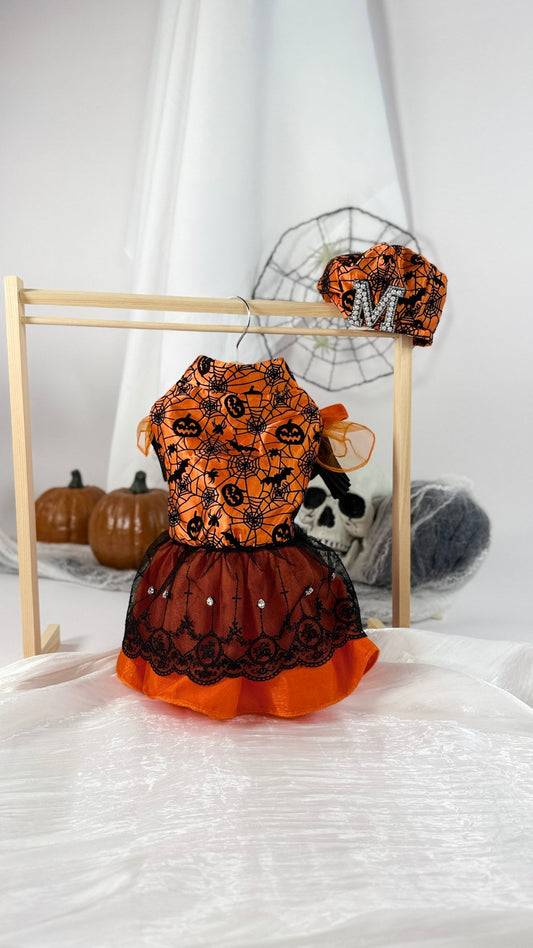 Bright orange Halloween pet dress with spooky prints