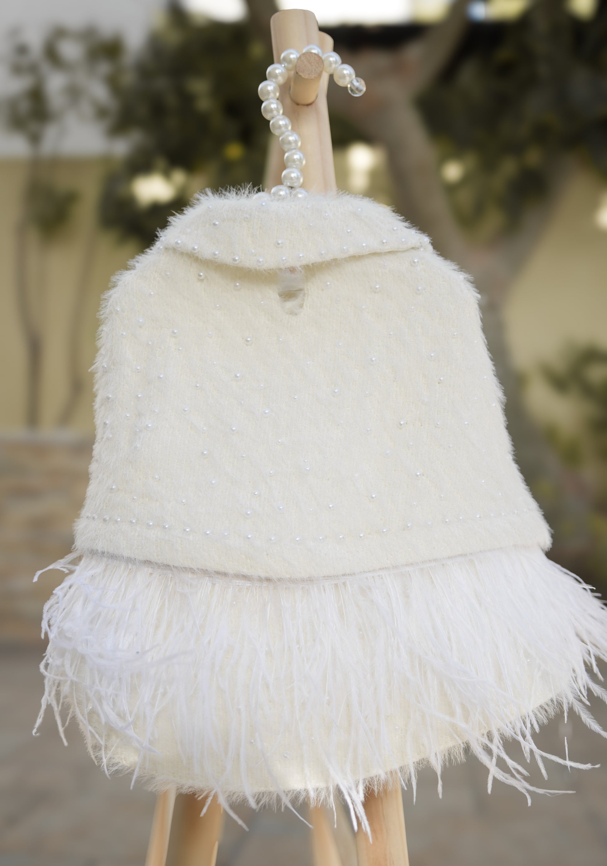 Elegant pet coat with delicate pearls and clip-on feathers