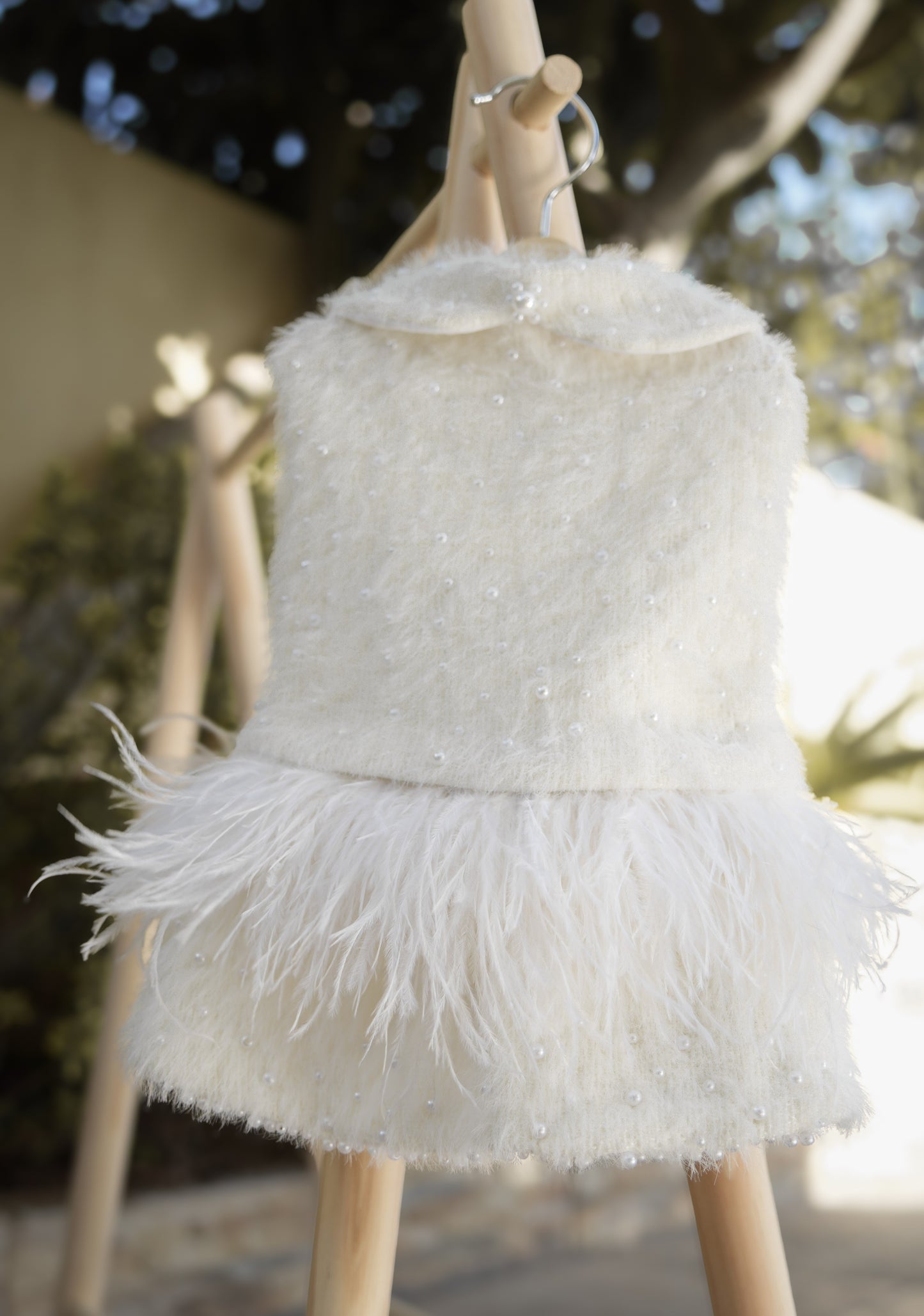 Soft pet outfit featuring small pearls and feather details
